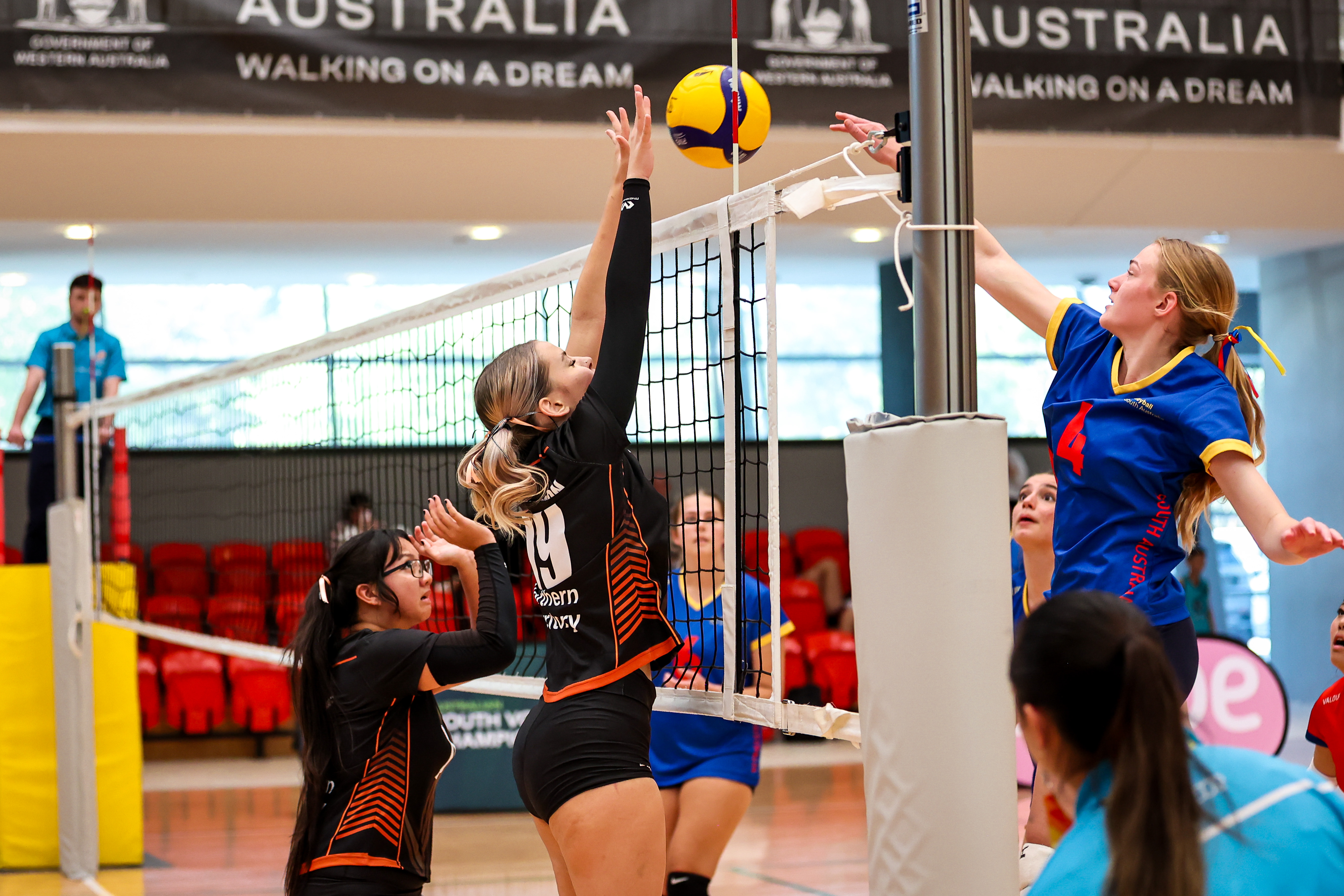 Youth Volleyball teams at the net