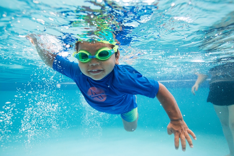 Boy learning to swim underwater at HBF Stadium