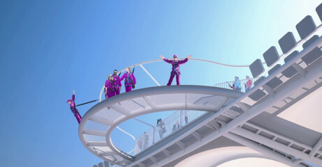 A low angle shot showing multiple people standing on the lookout point of the roof of Optus Stadium in Burswood, Perth