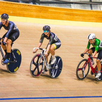 A photo of four riders competing in the Australian Track Cycling Championships held at the Speeddome in Middle Swan, Perth
