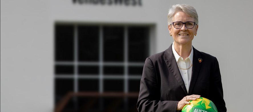 Chair Mary Anne Stephens outside VenuesWest office
