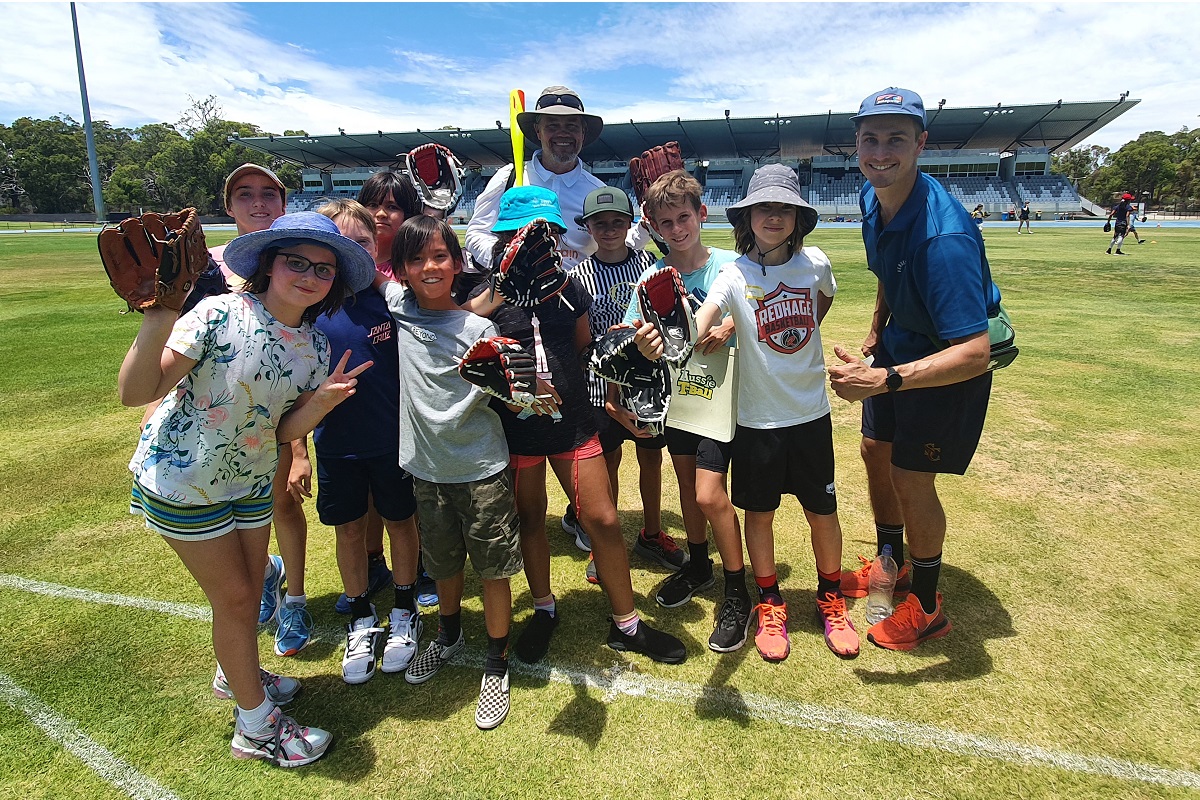 A photo kids grouped together posing for the camera